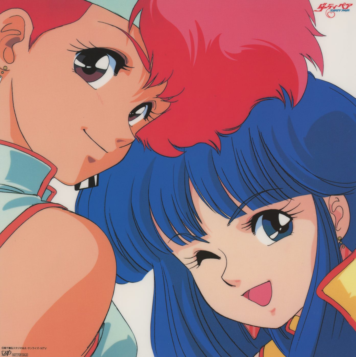 Box poster — large-format reproduction of the box front portrait: Kei and Yuri in close-up, faces filling the frame. Printed on coated stock. The box art in its intended scale.