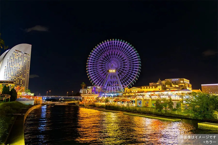 Cosmo Clock 21 wide shot &mdash; the purple illumination visible across Yokohama's waterfront, January 30 &ndash; February 24, 2026