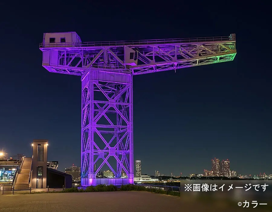 Hammer Head Crane &mdash; the 1914 industrial heritage structure lit in Unit-01 purple and green, Minato Mirai skyline behind