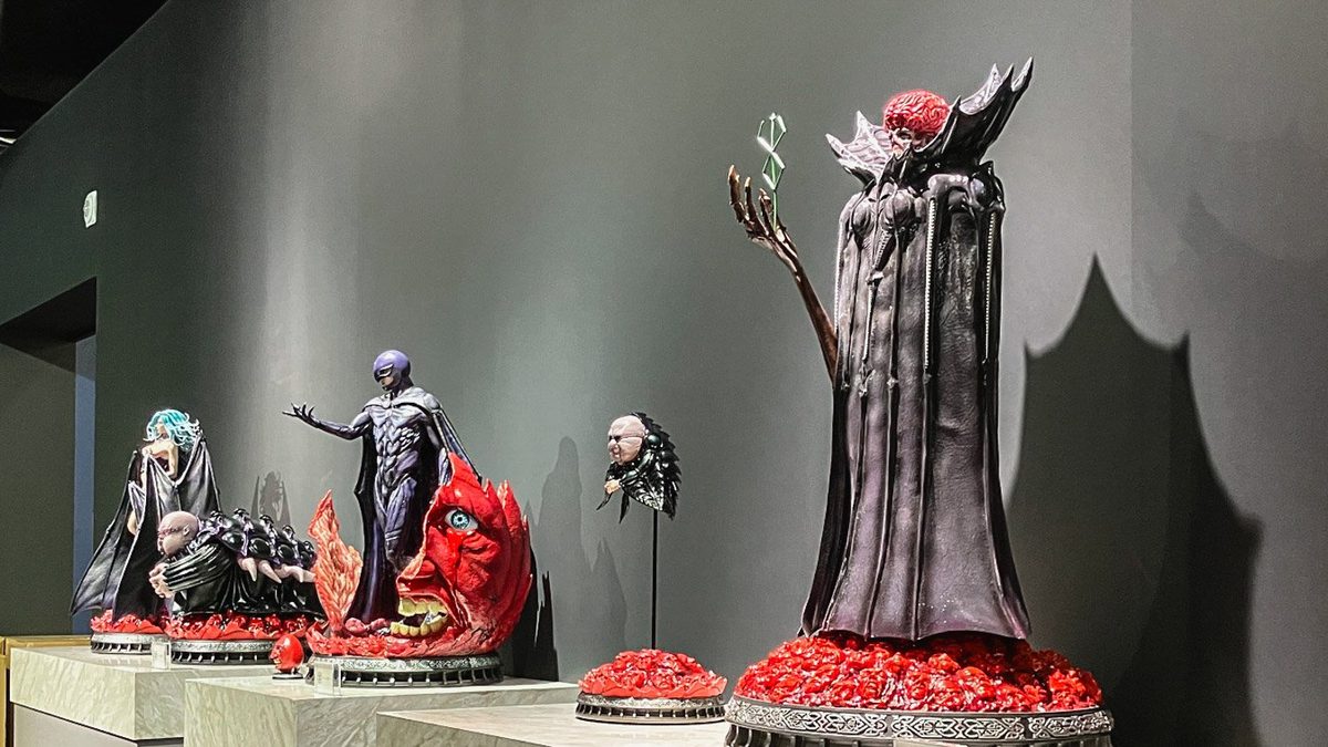The God Hand &mdash; Void, Femto, Slan, Ubik, and Conrad in their transcendental forms, displayed on stepped platforms in a darkened room