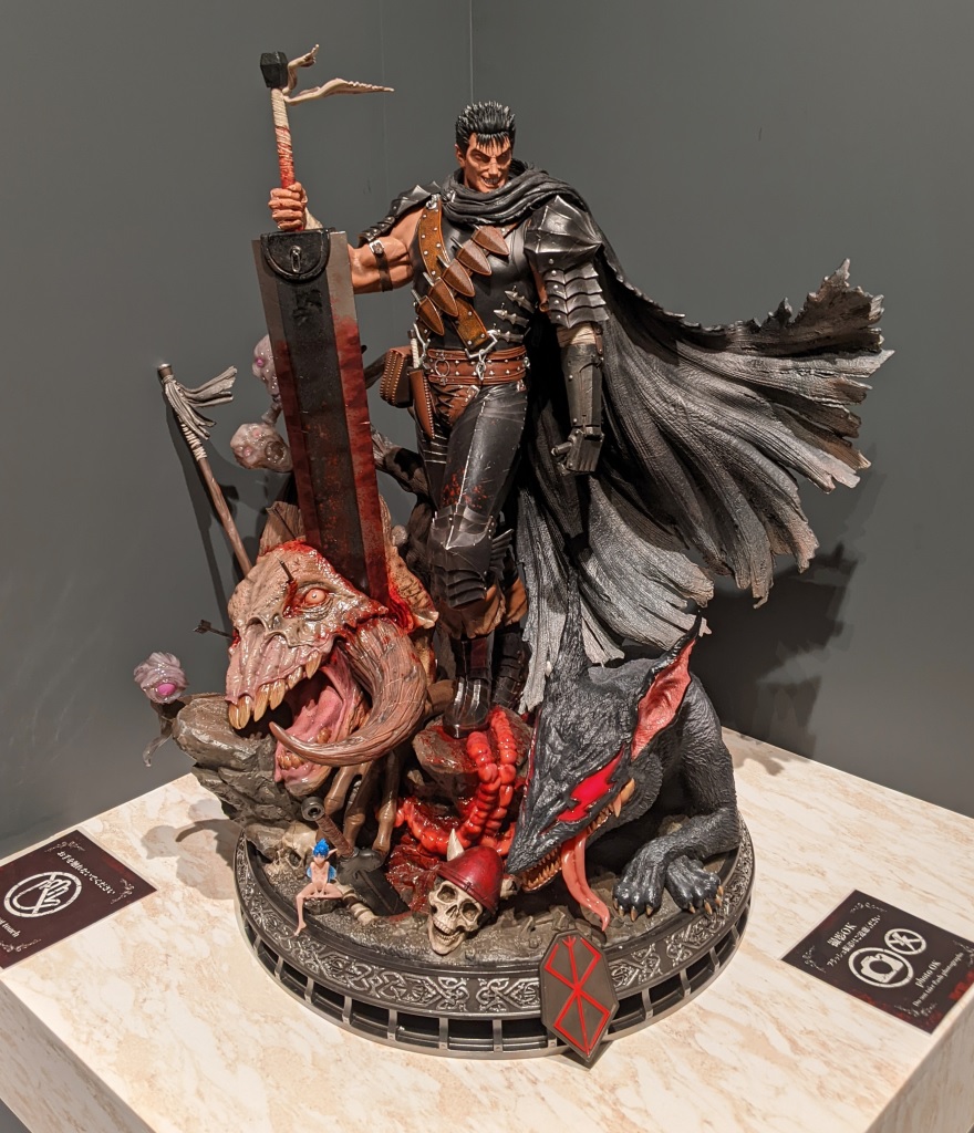 Guts, the Black Swordsman &mdash; life-sized Prime 1 Studio statue, Dragon Slayer planted amid fallen apostles and skulls