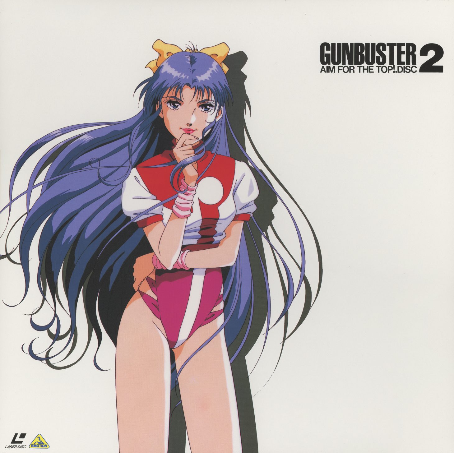 Disc 2 jacket front. Kazumi Amano — hair flowing past the jacket edge, finger to her chin. 'GUNBUSTER 2 AIM FOR THE TOP! DISC.' The same white background, the same clean isolation. Kubooka illustration.