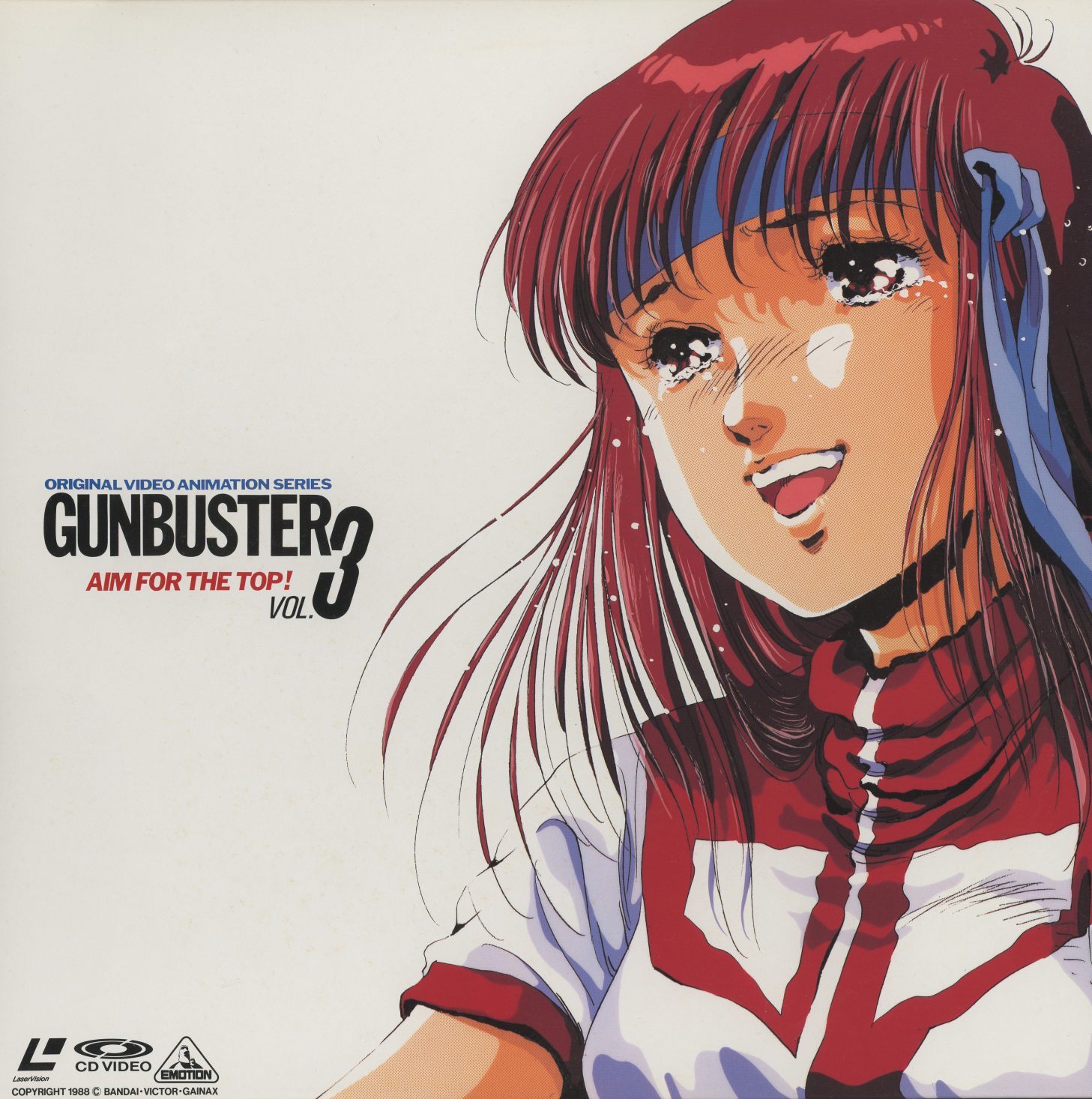 Original Vol. 3 jacket front (BEAL-211, July 1989). Noriko's face in closeup — eyes bright with tears, stars reflected. 'GUNBUSTER AIM FOR THE TOP! VOL.3.' The jacket art finally matches what the series became. No comedy. No ensemble. Just the weight.