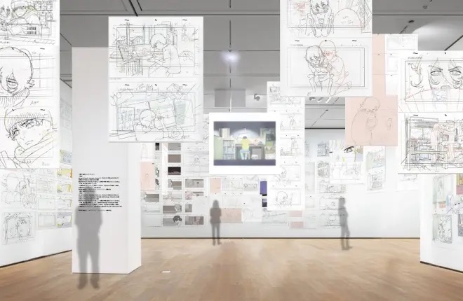 The 作画トンネル (animation tunnel) — hundreds of original drawings suspended throughout the gallery space, January 2026