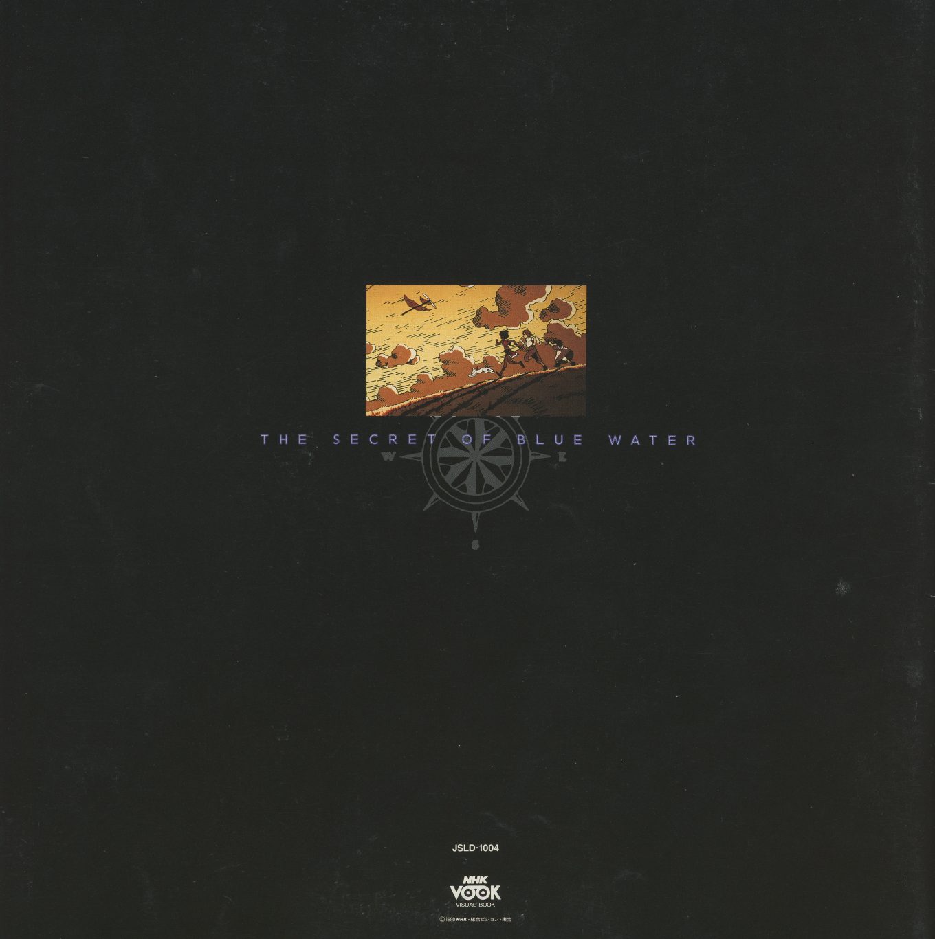 Box exterior back. 'THE SECRET OF BLUE WATER' in silver. JSLD-1004. NHK VOOK Visual Book compass logo. The sunset hillside illustration — small, centered — is the only image. The rest is black.
