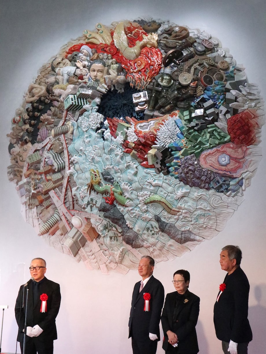 Otomo speaking at the December 12, 2020 unveiling &mdash; the relief fills the double-height entrance wall