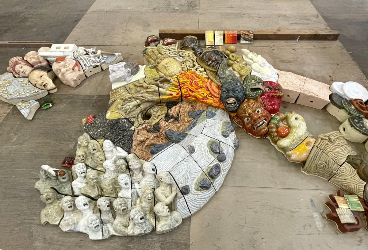 All 164 fired tiles assembled on the studio floor before installation