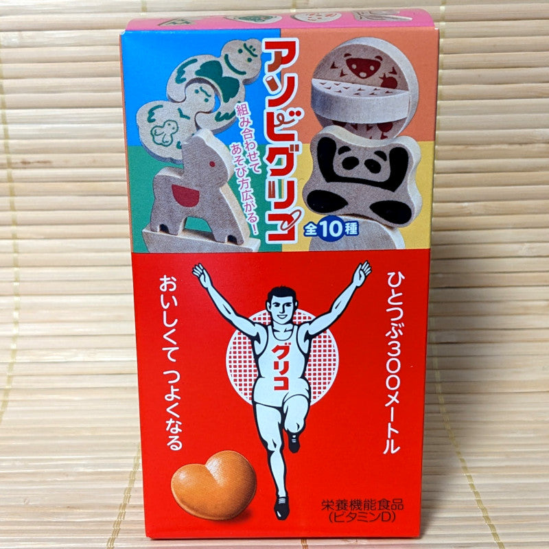 Modern Glico Caramel with wooden toy — continuity from 1927 to today