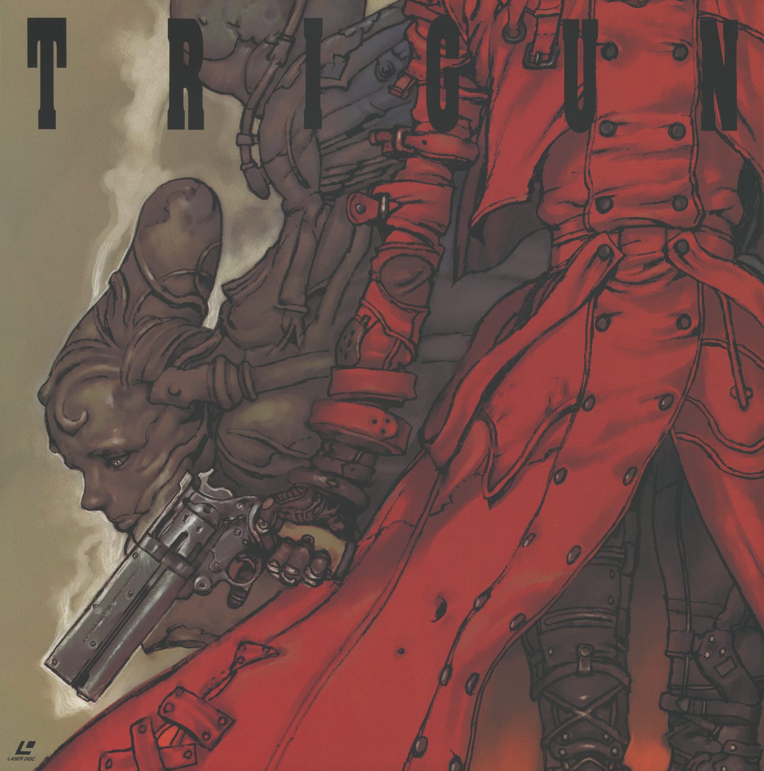 Slipcase front. Vash the Stampede from the waist down — red leather coat, mechanical arm, revolver lowered. The TRIGUN logo cut diagonally across the top. No stage number, no border, no character framing device: just the coat and the robot arm and the gun. The image that greets you before you pull out any of the thirteen volumes.