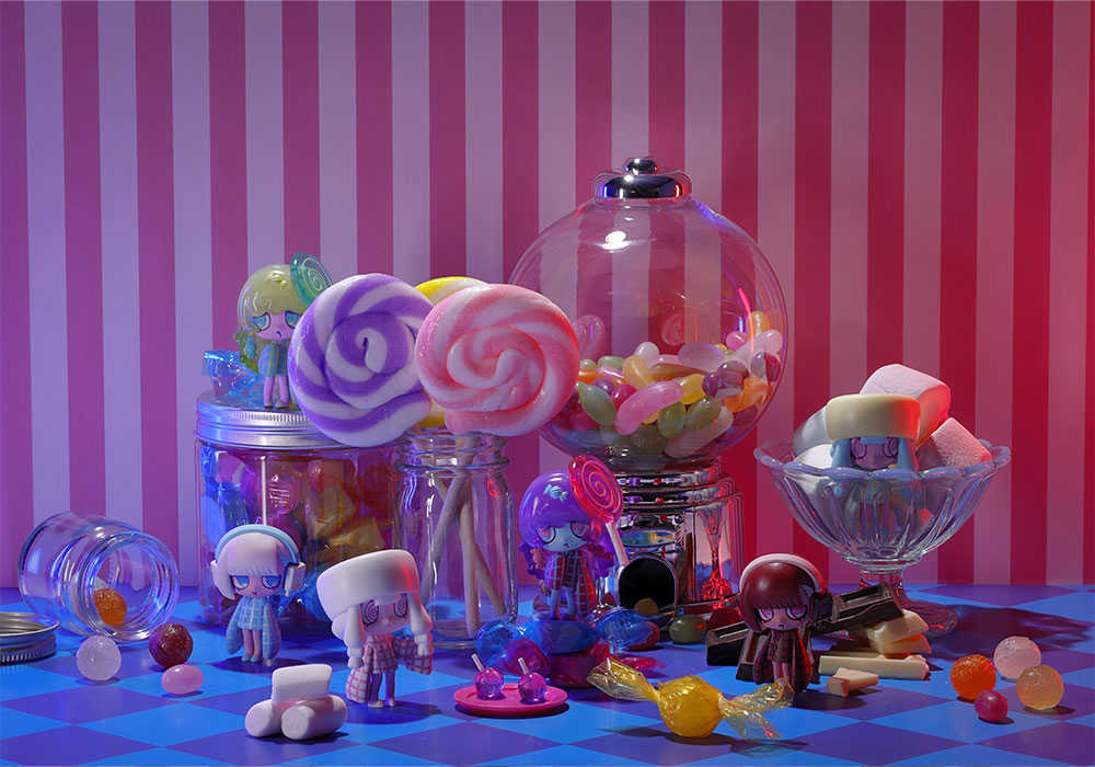 A full display arrangement. 24 characters, no anime, no manga, no prior franchise. Just desserts with spiral eyes and the faintest suggestion they know what they are.